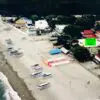 A beach with many boats parked on it